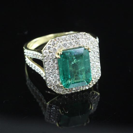 An 18ct gold, emerald and diamond cluster dress ring by Lorique, size O.